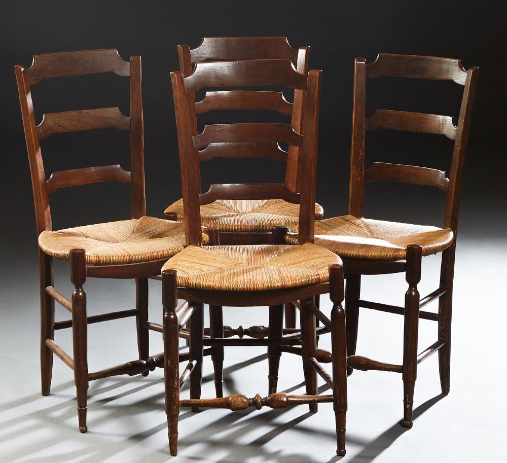 Set of Four French Provincial Carved Beech Rushseat: Set of Four French Provincial Carved Beech Rushseat Dining Chairs, late 19th c., the canted curved ladder back over a bowfront rush seat, on turned tapered legs joined by turned stretchers, H.- 34 1/2