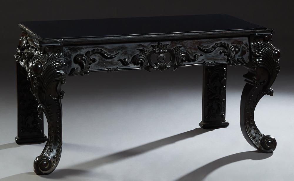 Victorian Style Carved Mahogany Console Table, 20th c.,: Victorian Style Carved Mahogany Console Table, 20th c., the rectangular top over a wide pierced scroll carved skirt, on pointed cabriole legs, now with a black glass top, H.- 27 in., W.- 50 1/4 in.. D