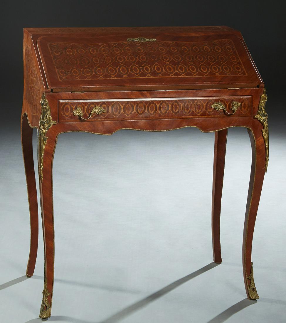 Louis XV Style Ormolu Mounted Parquetry Inlaid Mahogany: Louis XV Style Ormolu Mounted Parquetry Inlaid Mahogany Slant Front Secretary, 20th c., the slant lid with an inset gilt tooled leather writing surface enclosing an interior fitted with three drawers,