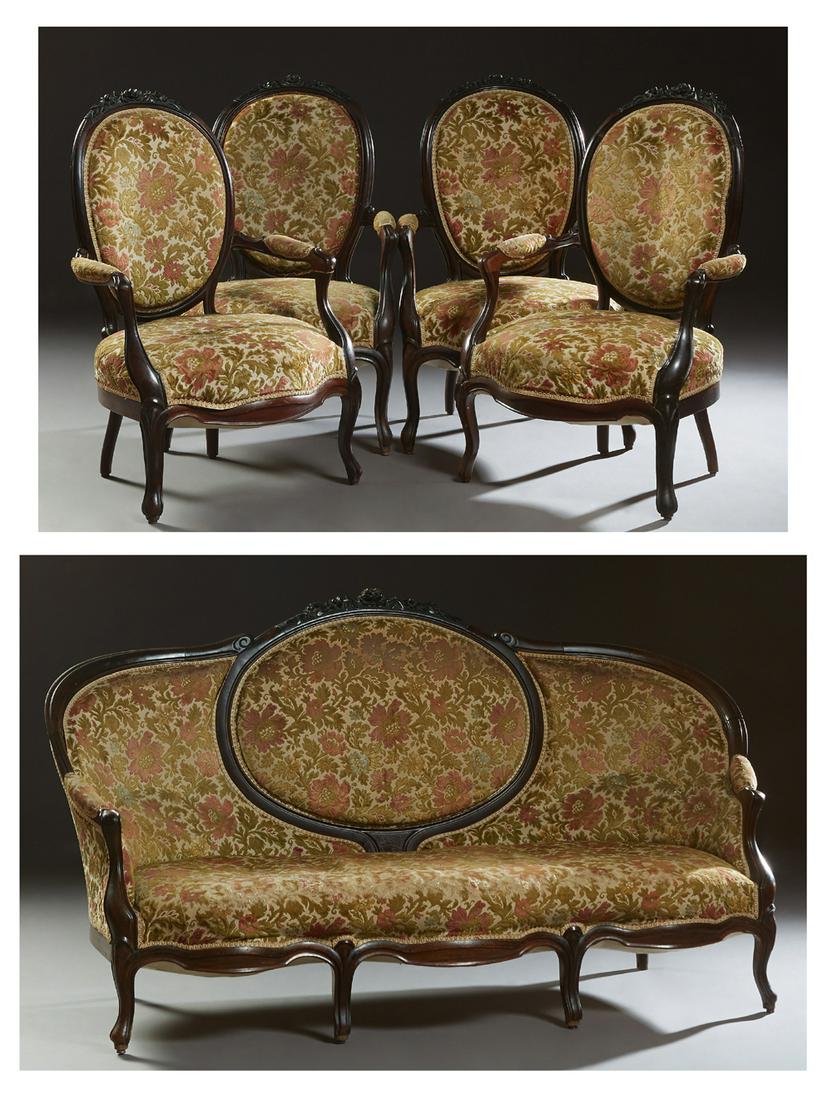French Louis XV Style Carved Beech Parlor Suite, early: French Louis XV Style Carved Beech Parlor Suite, early 20th c., consisting of four fauteuils and a settee with a floral carved crest rail above an oval upholstered back, flanked by curved upholstered 