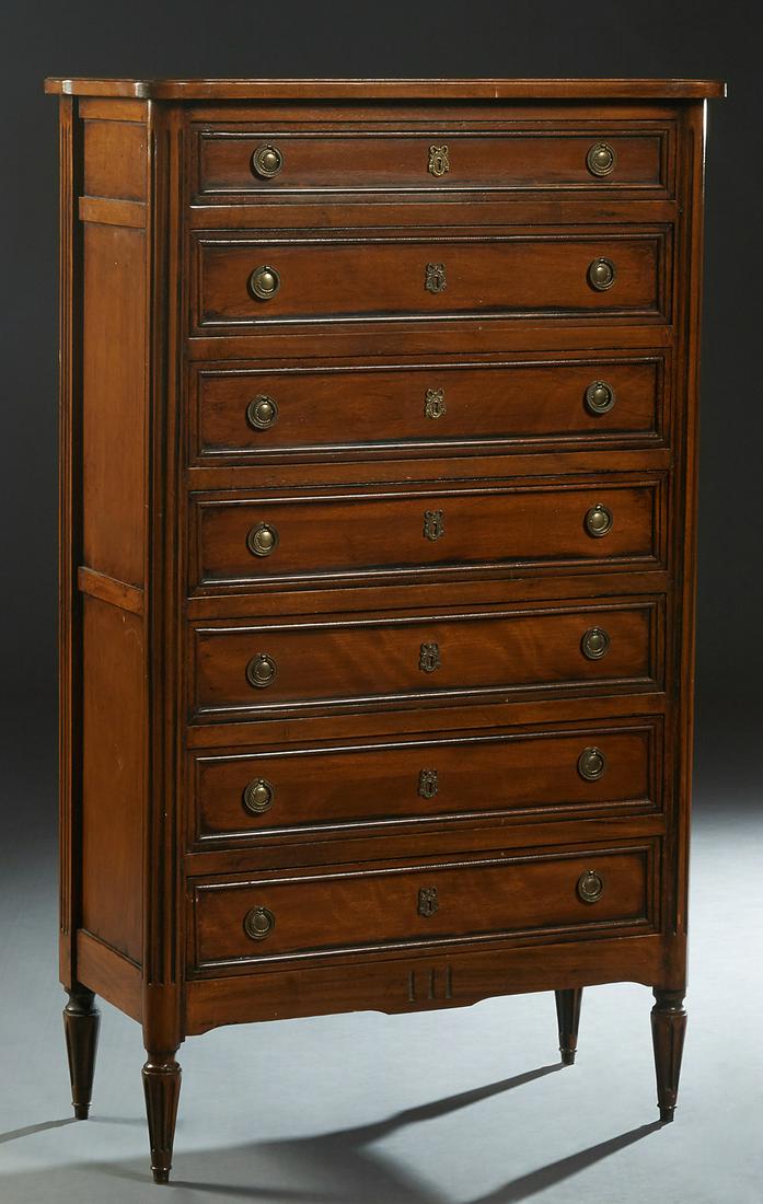 French Louis XVI Style Carved Beech Semainier, 20th c.,: French Louis XVI Style Carved Beech Semainier, 20th c., the stepped cookie corner top over seven drawers, flanked by reeded edge pilasters, on a plinth base on turned tapered reeded legs, H.- 54 1/2 i