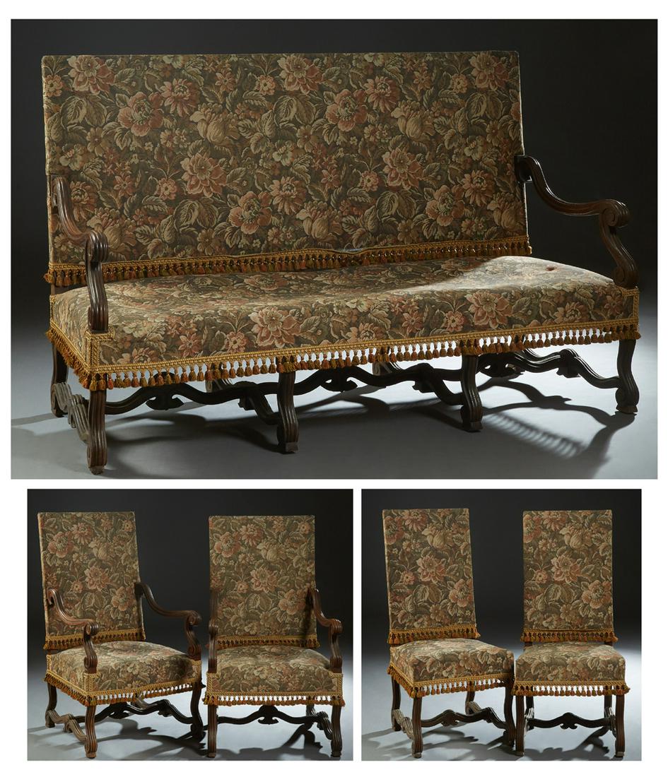 French Louis XIII Style Carved Oak Five Piece Parlor: French Louis XIII Style Carved Oak Five Piece Parlor Suite, early 20th c., consisting of two fauteuils, two side chairs and a settee, with canted rectangular upholstered backs to scrolled arms over tr