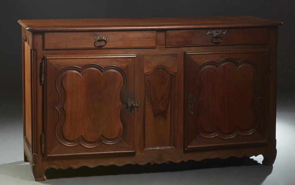 Louis XV Style Carved Elm and Walnut Louis XV Style: Louis XV Style Carved Elm and Walnut Louis XV Style Sideboard, the rounded edge and corner top over two frieze drawers above double fielded panel cupboard doors with iron fiche hinges and escutcheons,