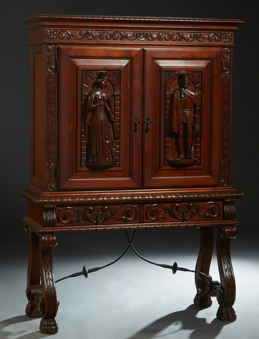 French Renaissance Carved Cherry China Cabinet, 20th: French Renaissance Carved Cherry China Cabinet, 20th c., the stepped carved edge crown over double doors with high relief carvings of a king and a queen, on a base with two frieze drawers, on pierced 