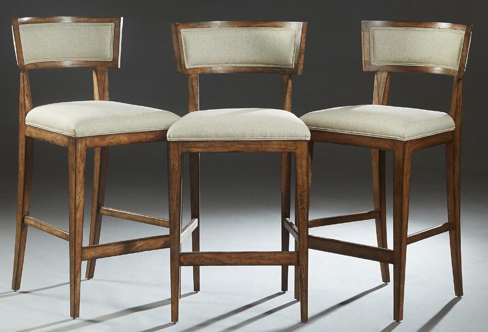 Set of Three Contemporary Carved Mahogany Bar Stools,: Set of Three Contemporary Carved Mahogany Bar Stools, 20th c., the curved cushioned canted back to a trapezoidal cushioned seat, on tapered square legs joined by rectangular stretchers, in pale blue-g