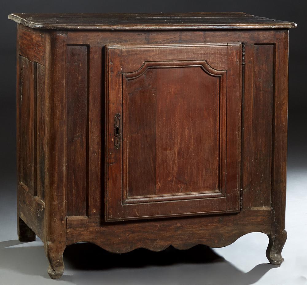 French Provincial Louis XIV Style Carved Beech: French Provincial Louis XIV Style Carved Beech Confiturier, 19th c., the rounded edge and corner three board top over a large cupboard door with a long iron fiche hinge and escutcheon, on cabriole leg