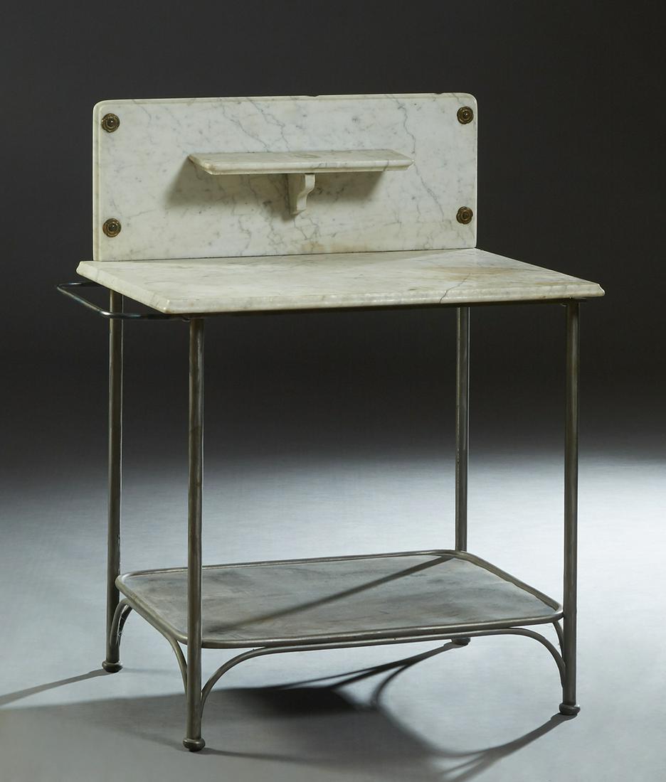 American Iron and Marble Top Washstand, early 20th c.,: American Iron and Marble Top Washstand, early 20th c., the ogee edge rounded corner back splash with a central horizontal shelf, over a figured white marble top, on cylindrical iron legs joined by a l