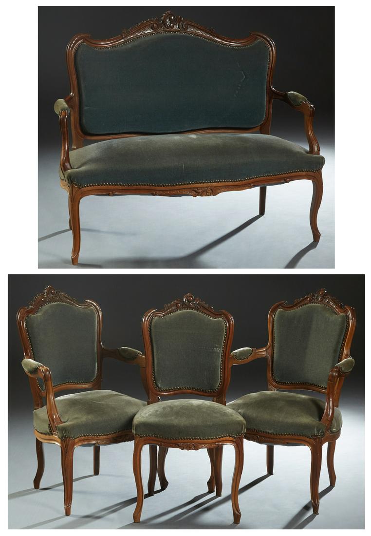 French Louis XV Style Carved Walnut Five Piece Parlor: French Louis XV Style Carved Walnut Five Piece Parlor Suite, early 20th c., consisting of a loveseat, two fauteuils and a side chair. each arched crest rail with C-scroll and leaf carving, to upholste