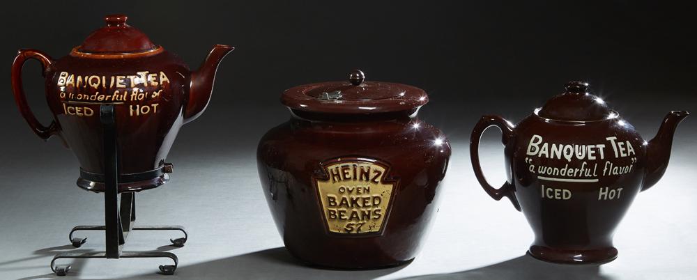 Three Country Store Brown Glazed Ceramic Countertop: Three Country Store Brown Glazed Ceramic Countertop Advertising Items, early 20th c,., consisting of two "Banquet Tea- A Wonderful Flavor, Iced or Hot" tea kettles, one in the original iron serving di