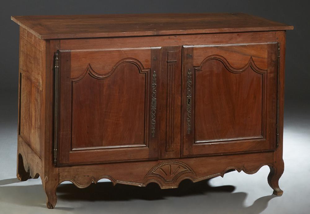 French Provincial Louis XV Style Carved Cherry Coffer,: French Provincial Louis XV Style Carved Cherry Coffer, 19th c., the rectangular lifting top over a front with faux double arched panel cupboard doors with long iron fiche hinges and escutcheons, flank