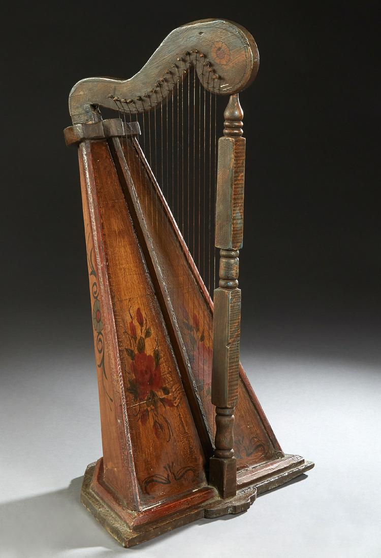 Carved Painted Celtic Table Harp, 19th c., with faux: Carved Painted Celtic Table Harp, 19th c., with faux bois and floral decoration, on a stepped hexagonal base, H.- 30 in., W.- 19 1/4 in., D.- 10 1/4 in.