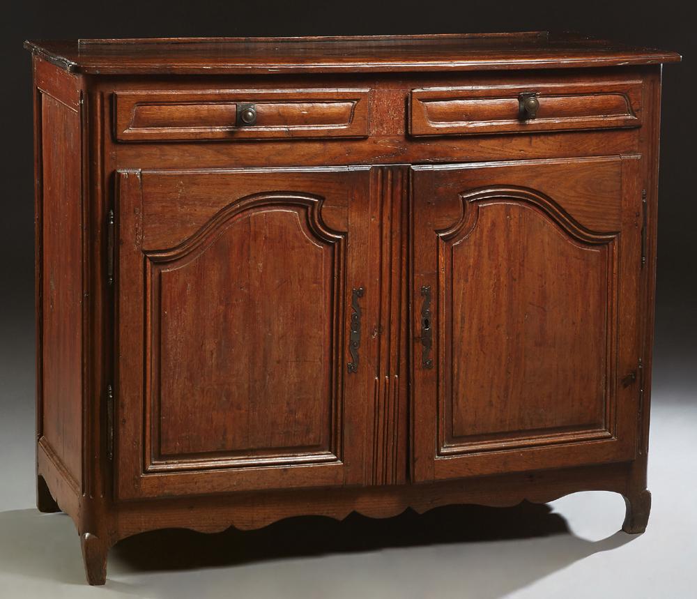 French Provincial Carved Oak Louis XV Style Sideboard,: French Provincial Carved Oak Louis XV Style Sideboard, 19th c., the rounded corner ogee edge top over two frieze drawers and two fielded panel cupboard doors with long iron escutcheons and fiche hinge
