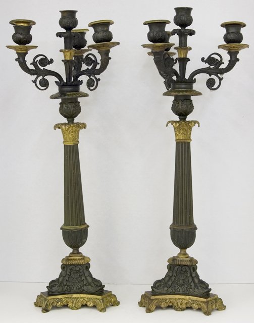 Pair of Empire Style Gilt and Patinated Bronze Fou: Pair of Empire Style Gilt and Patinated Bronze Four Light Candelabra, 19th c., on tripodal dolphin feet, to a stepped base with relief decoration, H.- 20 1/8 in., Dia.- 7 3/4 in.