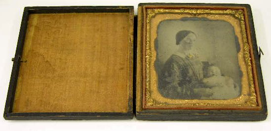 Ambrotype of a Woman and Child, 19th c., in a peri: Ambrotype of a Woman and Child, 19th c., in a period pressed board case, with a gilt metal liner, H.- 3 in., W.- 2 1/2 in.