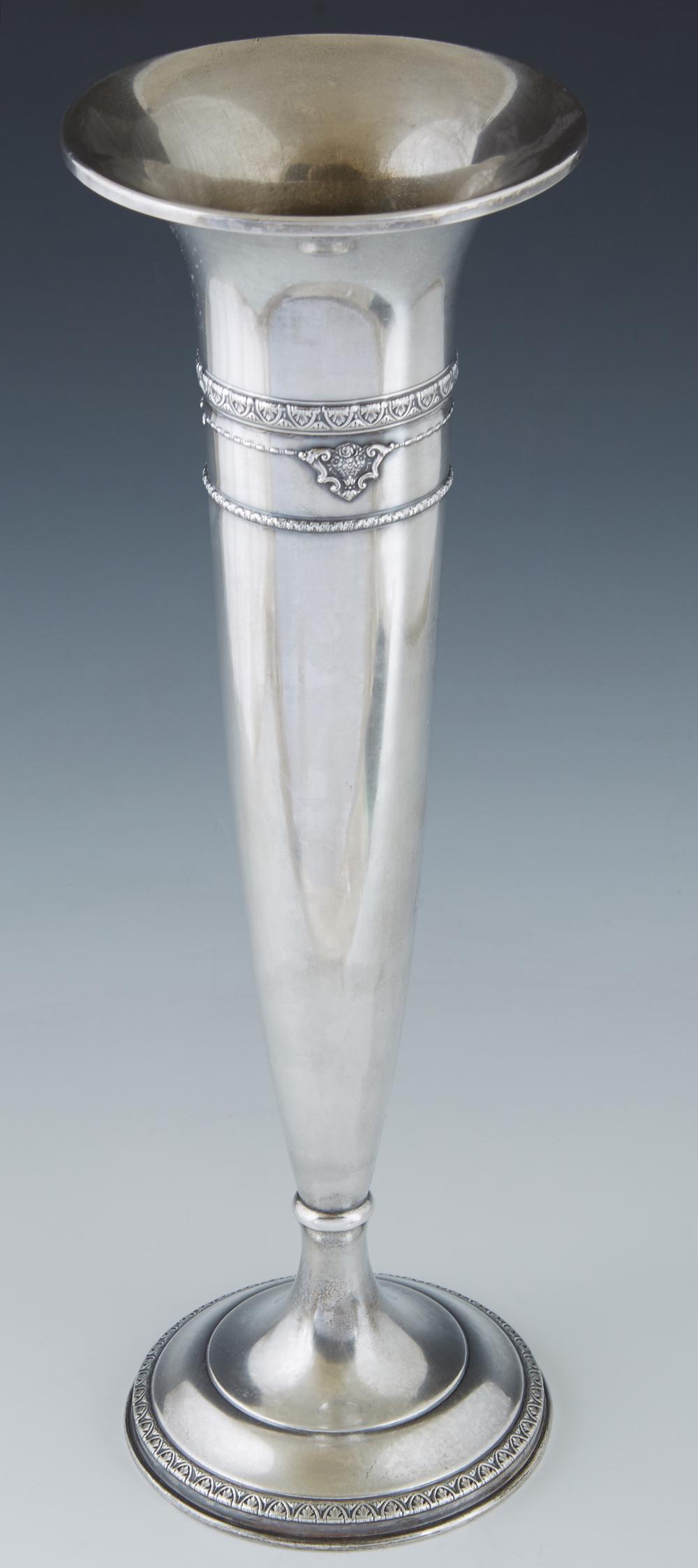 Weighted Sterling Trumpet Vase, early 20th c., by: Weighted Sterling Trumpet Vase, early 20th c., by Mauser, #1426, of tapering form, with repousse decoration, on an integral stepped circular base, H.- 16 in., Dia.- 5 in.