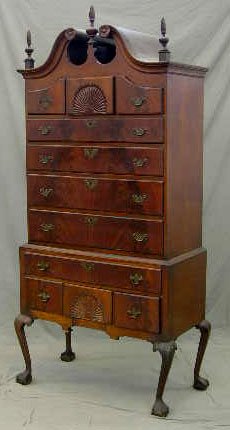 American Carved Mahogany Bonnet Top Highboy, late : American Carved Mahogany Bonnet Top Highboy, late 19th c., the top with a broken arch with a central twist finial flanked by twist finials on either side, over three small frieze drawers, the center o