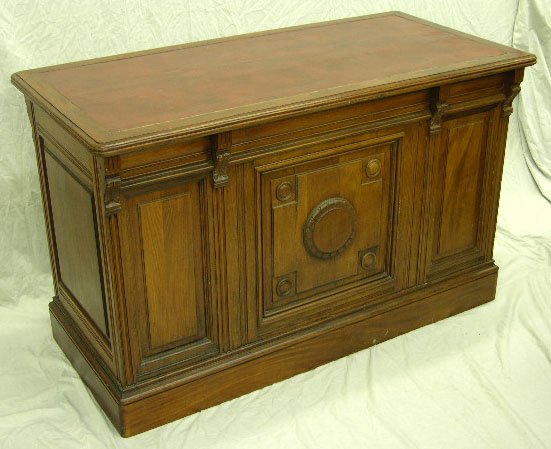 Diminutive English Carved Mahogany Lady's Desk, c.: Diminutive English Carved Mahogany Lady's Desk, c. 1900, with a leather inset top above four frieze drawers, on double pedestals with four drawers each, the whole with fielded panel sides, the front w