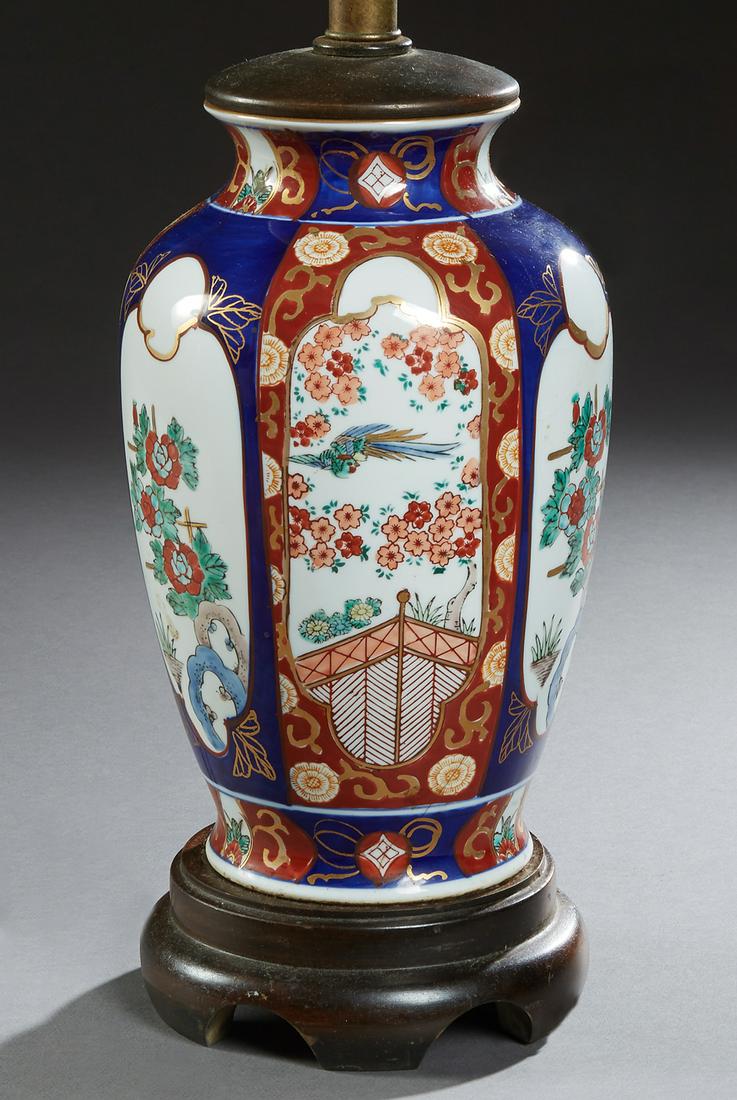 Chinese Porcelain Baluster Vase, 20th c., with floral: Chinese Porcelain Baluster Vase, 20th c., with floral and bird decorated panels, with a mahogany cap and base, now wired as a lamp, labeled Frederick Cooper, Chicago, H.- 15 in., Dia.- 7 1/2 in.