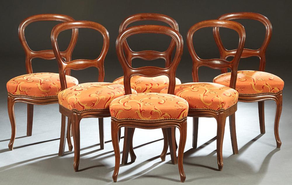 Set of Six French Carved Walnut Louis Philippe Dining: Set of Six French Carved Walnut Louis Philippe Dining Chairs, 19th c., the arched curved medallion back over a bowed upholstered seat, on cabriole legs with toupie feet, in leaf and scroll decorated f
