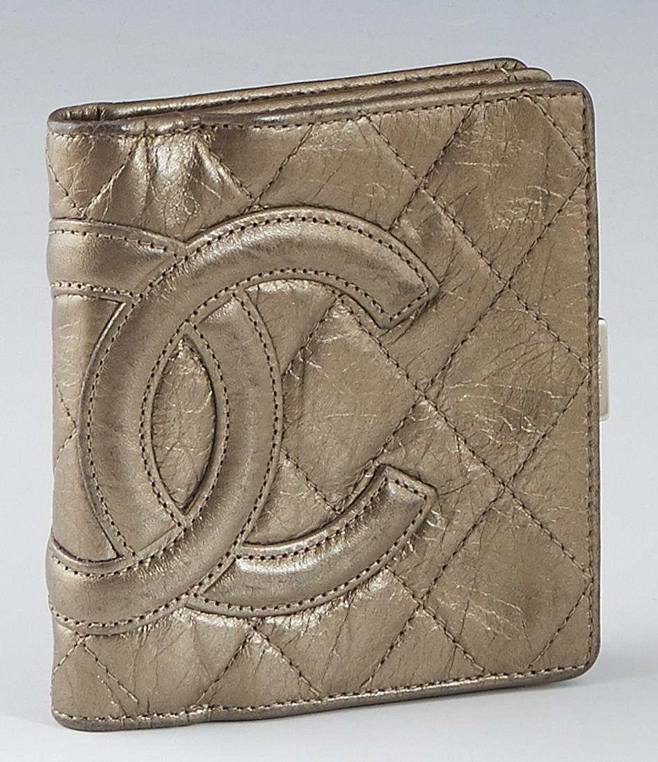 Chanel Cambon Ligne Small Wallet, in gold quilted calf: Chanel Cambon Ligne Small Wallet, in gold quilted calf leather and ruthenium hardware, the snap closure opening to eight card slots, a bill holder lined in creme Chanel logo fabric, and an exterior sn