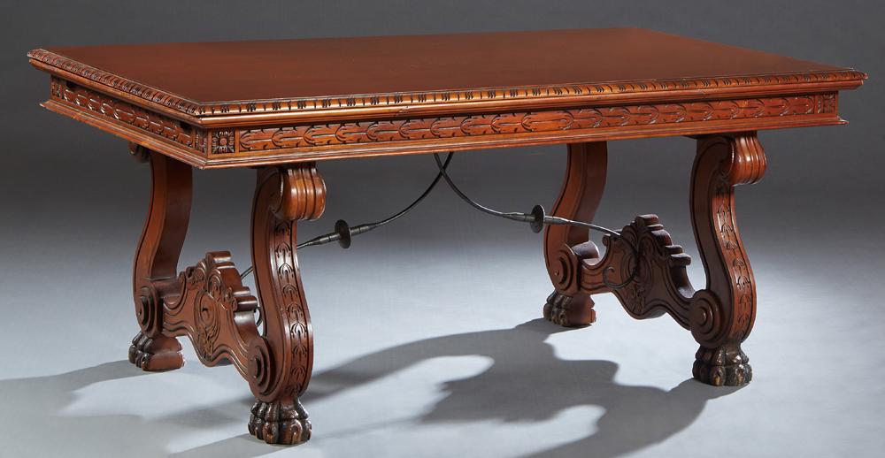 French Renaissance Style Drawleaf Dining Table, 20th: French Renaissance Style Drawleaf Dining Table, 20th c., the carved rounded edge top over a carved skirt, with two draw leaves, on large paw foot trestle supports joined by large carved wood stretcher