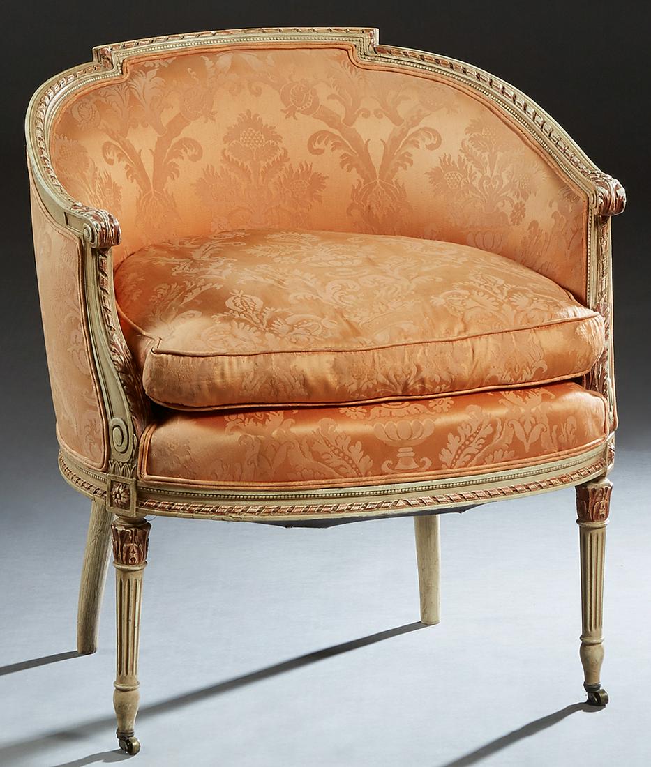 French Polychromed Carved Beech Louis XVI Style: French Polychromed Carved Beech Louis XVI Style Bergere, 20th c., the stepped curved back to scrolled arms, flanking a bowed removable cushion seat, on turned tapered reeded legs, in orange silk flora