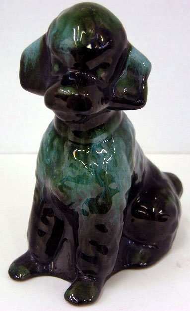 Green and Brown High Glaze Earthenware Figure of a: Green and Brown High Glaze Earthenware Figure of a Poodle, 20th c., unmarked, H.- 7 1/4 in., W.- 3 1/8 in., D.- 5 1/2 in.