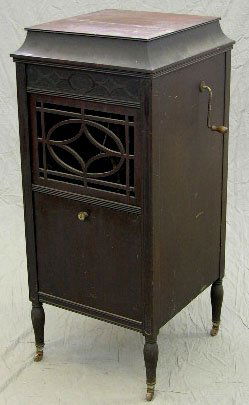 Edison Carved Mahogany Upright Windup Gramophone,: Edison Carved Mahogany Upright Windup Gramophone, c. 1920, Model C-150, with a record storage compartment below the enclosed speaker, in working order, H.- 44 1/4 in., W.- 18 5/8 in., D.- 20 1/8 in.