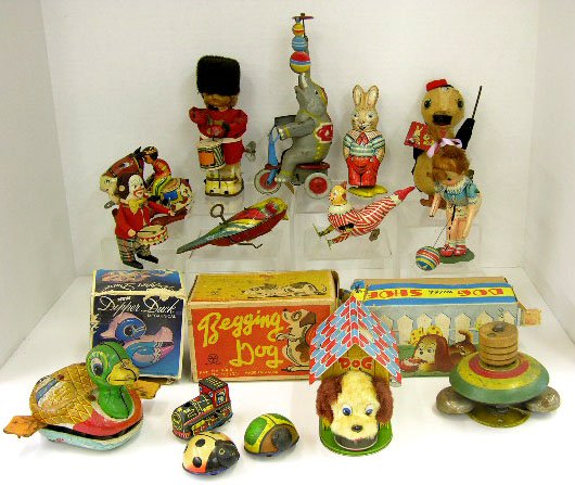 Group of Eighteen Tin Lithographed Toys-most windu: Group of Eighteen Tin Lithographed Toys-most windup- Beefeater drummer with fur hat, 2 Lehmann Lili beetles, begging dog, elephant on tricycle, drumming gorilla, dog in doghouse, walking chicken, loco