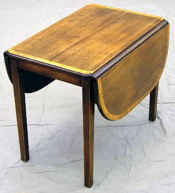 Diminutive Banded Mahogany Drop Leaf Coffee Table,: Diminutive Banded Mahogany Drop Leaf Coffee Table, early 20th c., with a shaped top, the whole on square tapering legs, H.- 16 1/2 in., W.- Closed- 13 1/2 in., Open- 27 1/2 in., D.- 19 1/8 in.