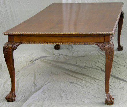 Carved Mahogany Chippendale Style Dining Table, 20: Carved Mahogany Chippendale Style Dining Table, 20th c., the gadrooned edge top on cabriole legs with acanthus carved knees, to ball and claw feet, H.- 31 1/2 in., W.- 47 1/8 in., D.- 94 1/2 in.