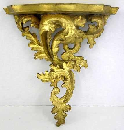 Gilt Florentine Wall Bracket, early 20th c., the p: Gilt Florentine Wall Bracket, early 20th c., the plate grooved bowed shelf with swirling leaf form supports, H.- 10 3/4 in., W.- 10 3/8 in., D.- 6 in.