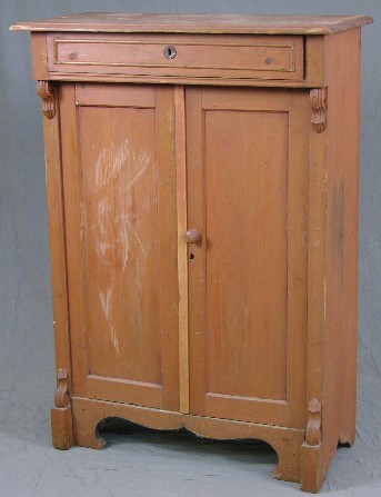 Carved Pine Dry Sink, 19th c., with a long frieze d: Carved Pine Dry Sink, 19th c., with a long frieze drawer over double cupboard doors, in original brown paint, H.- 53 1/2 in., W.- 35 1/2 in., D.- 17 1/4 in.