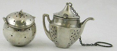 Two Sterling Tea Balls, early 20th c., one of ball: Two Sterling Tea Balls, early 20th c., one of ball form, the other a teapot.