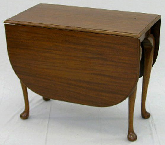 Carved Mahogany Queen Anne Style Dining Table, 20t: Carved Mahogany Queen Anne Style Dining Table, 20th c., on cabriole legs, to pad feet, H.- 29 1/2 in., W.- Closed- 19 1/4 in., Open- 58 7/8 in., D.- 36 in.