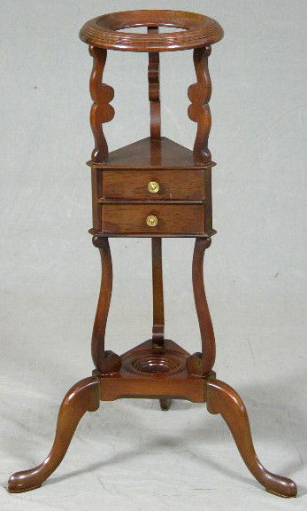 Georgian Style Carved Mahogany Shaving Stand, 20th: Georgian Style Carved Mahogany Shaving Stand, 20th c., the top with a circular bowl receptacle, over a center triangular section with two drawers, to a triangular base on cabriole legs, H.- 32 1/2 in.