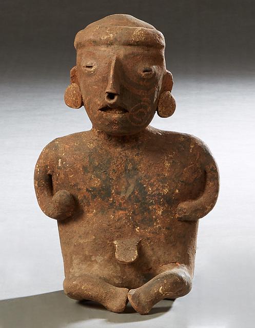 Pre-Columbian Pottery Figure, of a seated man with a (1 of 11)