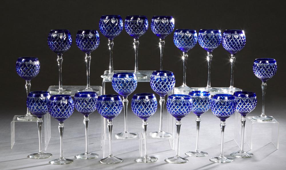 Set of Twenty-one Cobalt Cut-to-Clear Cut Glass Wine: Set of Twenty-one Cobalt Cut-to-Clear Cut Glass Wine Glasses, 20th c., on a tapered stem to a circular base, H.- 9 in., Dia.- 3 1/4 in. (21 Pcs.) Provenance: Palmira, the Estate of Sarkis Kaltakdjian 