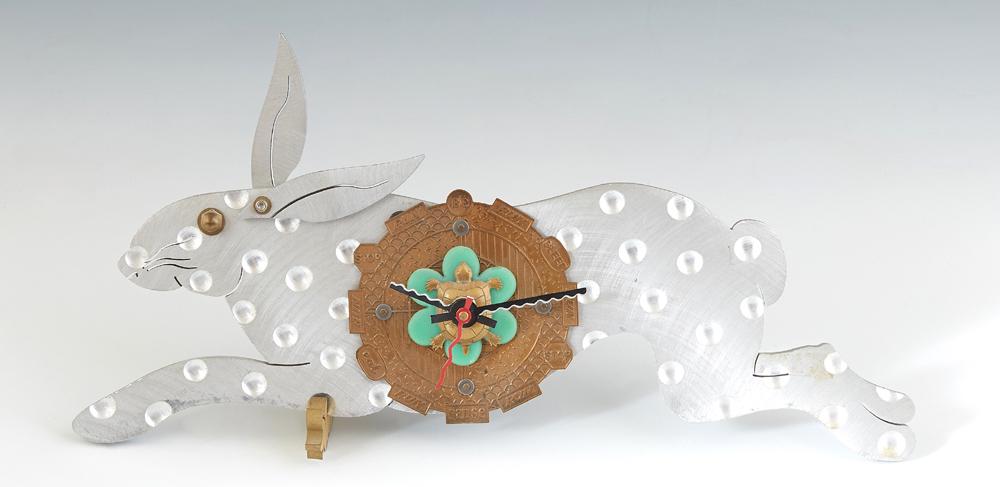 Thomas Mann (1947-, New Orleans), "Techno Rabbit: Thomas Mann (1947-, New Orleans), "Techno Rabbit Clock," 20th c., mixed metal sculpture, signed verso and marked Techno Romantic Design, with a carrot form stand, H.- 6 in., W.- 13 1/4 in., D.- 1 1/8