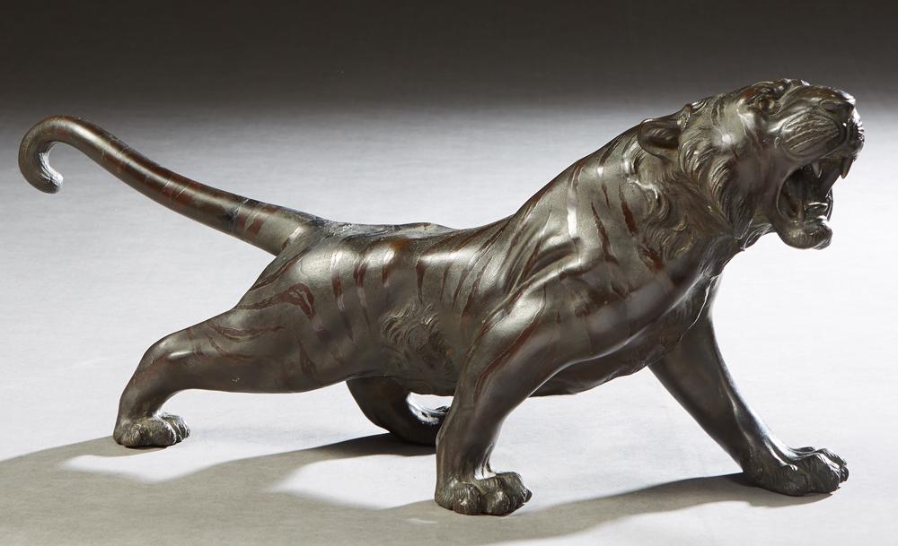 Japanese Meiji Patinated Bronze Stalking Tiger, with an: Japanese Meiji Patinated Bronze Stalking Tiger, with an attached calligraphy label on the underside, H.- 9 in., W.- 19 1/4 in., D- 5 in. Provenance: Palmira, the Estate of Sarkis Kaltakdjian (Sarkis O