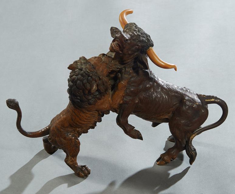 Attr. to Franz Xavier Bergmann (1861-1936, Austrian),: Attr. to Franz Xavier Bergmann (1861-1936, Austrian), "Lion Attacking a Steer," early 20th c., cold painted bronze, with carved Bone horns, unsigned, H.- 8 1/4 in., W.- 6 in., D.- 12 1/4 in.