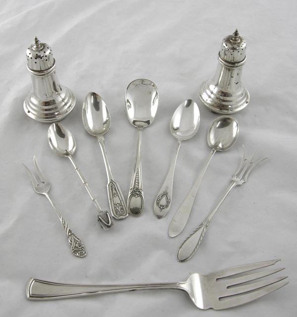 Group of Ten Pieces of Sterling- pair of s: Group of Ten Pieces of Sterling- pair of salt and pepper shakers, 5 teaspoons, 2 pickle forks and a cold meat fork, wt.- 8 troy oz. (9 Pcs.)