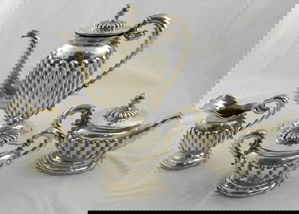 Four Piece Russian .875 Silver Tea Set, 19: Four Piece Russian .875 Silver Tea Set, 19th c., with Latvian marks, consisting of a coffee pot, teapot, covered sugar and creamer, all of lobed design, wt.- 50.6 troy oz.