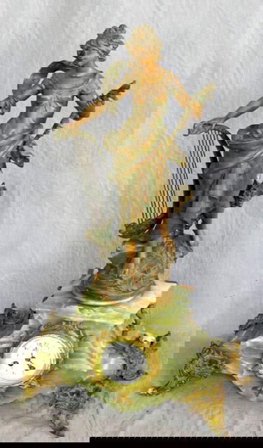 French Patinated Spelter Art Nouveau Figur: French Patinated Spelter Art Nouveau Figural Clock, c. 1890, the top with a figure of "La Melodie" by. Auguste Moreau, on a green onyx base with gilt spelter mounts and feet, the clock with a floral p