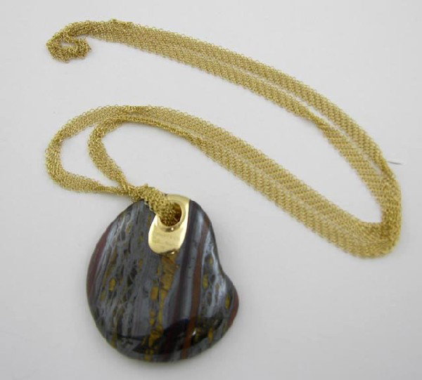Tiffany & Co. 18K Yellow Gold Tiger Iron F: Tiffany & Co. 18K Yellow Gold Tiger Iron Freeform Pendant, by Elsa Peretti, on a wide multi strand gold link chain, L.- 27 in.