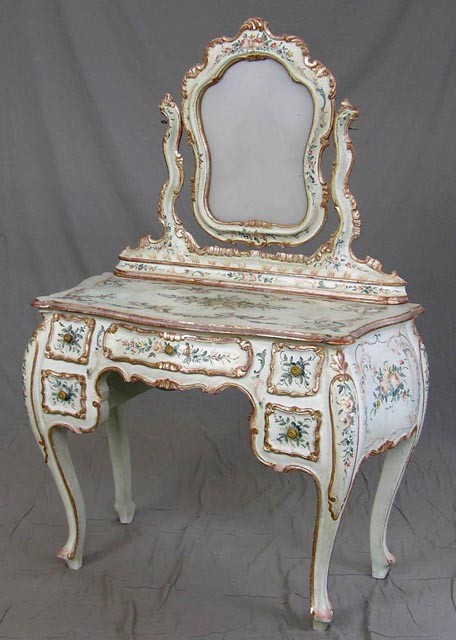 Italian Paint Decorated Bombe Dressing T: Italian Paint Decorated Bombe Dressing Table, 20th c., with a shaped mirror, on a bow front base with floral painted decoration, with a central frieze drawer flanked by four small drawers, the whole o
