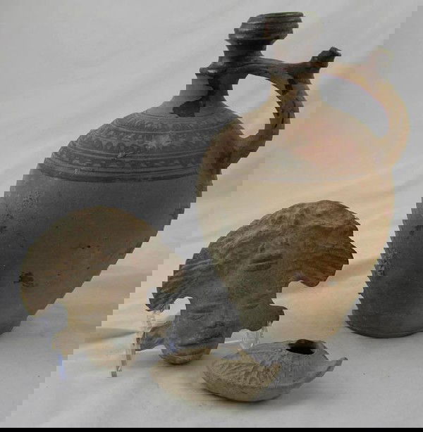 Group of Three Earthenware Items- an an: Group of Three Earthenware Items- an ancient Roman oil lamp. A pre-Columbian mask from the Justine Godchaux McCarthy collection, and an African jar with paint decoration.