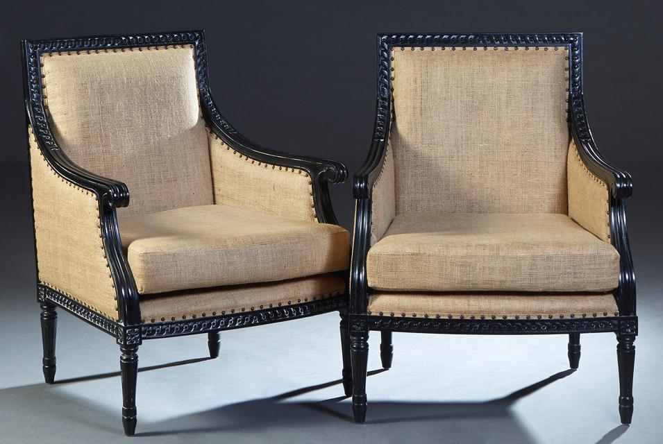 Pair of Louis XVI Style Ebonized Beech Bergeres, 20th: Pair of Louis XVI Style Ebonized Beech Bergeres, 20th c., the lappet carved crest rail over a rectangular back and reeded scrolled arms to a bowed seat with a removable cushion, on turned tapered reed