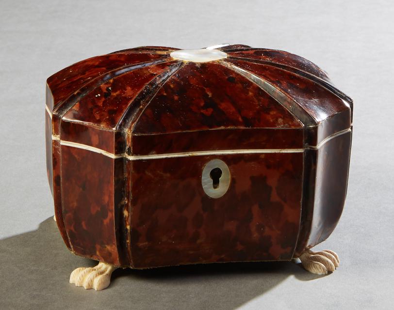 Tortoise Shell and Bone Tea Caddy, 19th c., of oval: Tortoise Shell and Bone Tea Caddy, 19th c., of oval octagonal form, the domed segmented lid with a central mother-of-pearl medallion, over octagonal curved sides, on bone paw feet, the interior with t