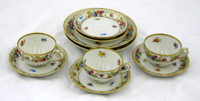 Ten Piece Porcelain Partial Tea Set, 20th c., by Sc: Ten Piece Porcelain Partial Tea Set, 20th c., by Schumann, in the "Chateau" pattern, with gilt and floral decoration, consisting of 3 demitasse cups, 5 saucers, and 2 coffee cup saucers.